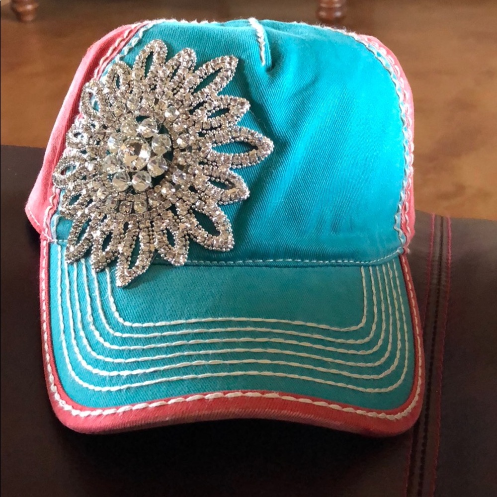 Turquoise/Corral distressed cap with rhinestones.